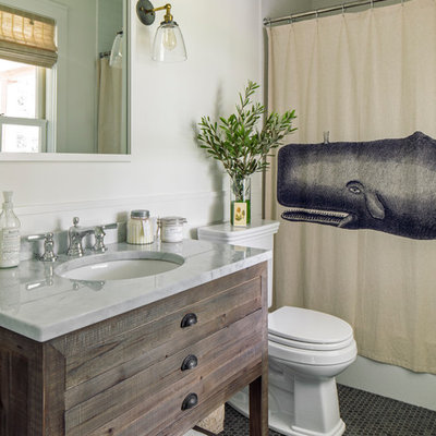 Small beach style 3/4 white tile mosaic tile floor and gray floor bathroom photo in Boston with white walls, marble countertops, white countertops, furniture-like cabinets, dark wood cabinets and an undermount sink