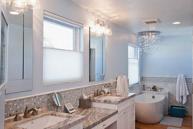 Example of a mid-sized transitional master multicolored tile and mosaic tile medium tone wood floor bathroom design in Salt Lake City with an undermount sink, recessed-panel cabinets, white cabinets, granite countertops, a two-piece toilet and blue walls