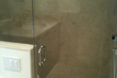 Inspiration for a contemporary doorless shower remodel in Miami