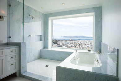 Example of a mid-sized transitional master white floor bathroom design in San Francisco with white walls, an undermount tub, a wall-mount sink, recessed-panel cabinets, white cabinets and marble countertops