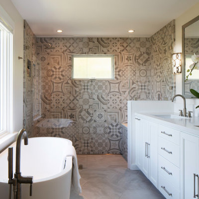 Example of a large transitional master beige tile and ceramic tile limestone floor and beige floor bathroom design in San Francisco with white cabinets, white walls, an undermount sink, quartz countertops, white countertops and recessed-panel cabinets