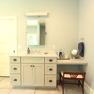 Separate light grey vanities in Master Bathroom with Sit Down Area