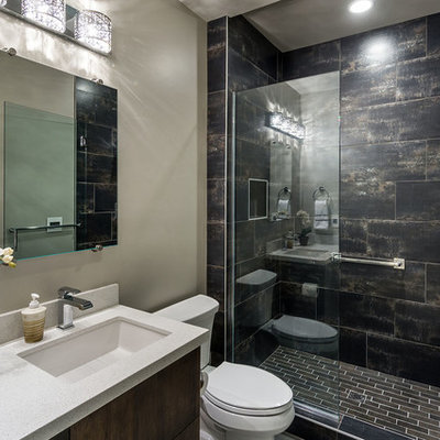 Alcove shower - mid-sized modern 3/4 black tile and porcelain tile porcelain tile alcove shower idea in Other with an undermount sink, flat-panel cabinets, dark wood cabinets, quartz countertops, a two-piece toilet and gray walls