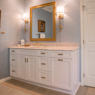 Inspiration for a large timeless master ceramic tile corner shower remodel in Cedar Rapids with blue walls, recessed-panel cabinets, white cabinets, an undermount sink and quartz countertops
