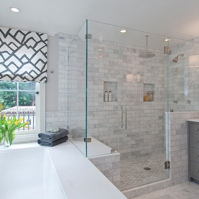 Example of a large transitional master gray tile and porcelain tile ceramic tile and multicolored floor bathroom design in Chicago with gray cabinets, a one-piece toilet, gray walls, a console sink, marble countertops, shaker cabinets and a hinged shower door