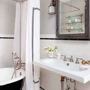 Small eclectic porcelain tile and black and white tile mosaic tile floor bathroom photo in DC Metro with a wall-mount sink and gray walls