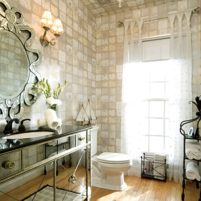 Example of an eclectic bathroom design in DC Metro with an undermount sink and furniture-like cabinets
