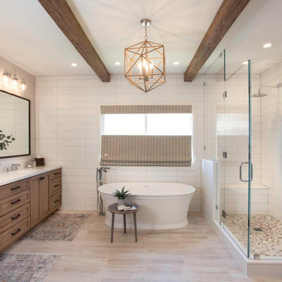 Large beach style master white tile and ceramic tile porcelain tile and beige floor bathroom photo in San Diego with recessed-panel cabinets, beige cabinets, a two-piece toilet, white walls, an undermount sink, quartz countertops, a hinged shower door and white countertops