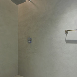 Bathroom - contemporary concrete floor bathroom idea in Miami with gray walls, an integrated sink and concrete countertops