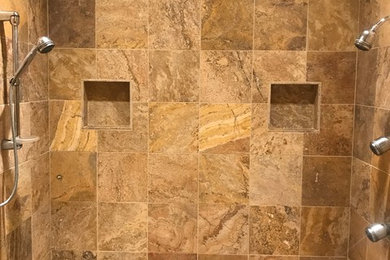 Bathroom - brown tile and travertine tile mosaic tile floor and beige floor bathroom idea in Other