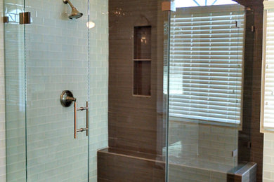 Inspiration for a large transitional master blue tile and subway tile porcelain tile and brown floor bathroom remodel in Orange County with beige walls and a hinged shower door