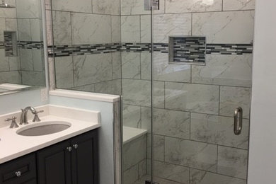 Trendy 3/4 black and white tile bathroom photo in DC Metro with white walls
