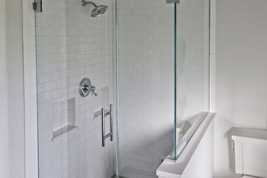 Corner shower - contemporary corner shower idea in Other with white walls and a hinged shower door