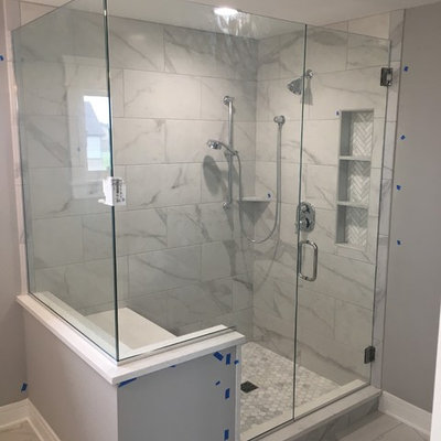 Corner shower - mid-sized contemporary master gray tile, white tile and marble tile marble floor and white floor corner shower idea in Chicago with gray walls and a hinged shower door