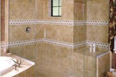 Example of a large master beige tile and ceramic tile doorless shower design in Kansas City with brown walls