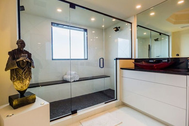 Example of a minimalist bathroom design in Miami with a hinged shower door