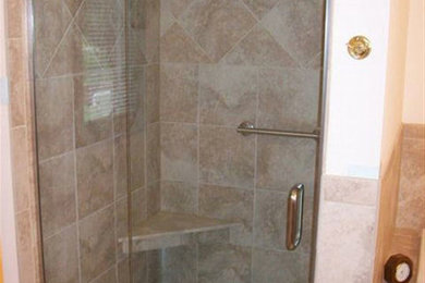 Large alcove shower photo in Charlotte with beige walls