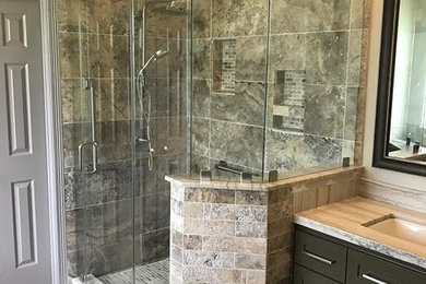 Photo of a medium sized rustic ensuite bathroom in Houston with dark wood cabinets, a submerged sink, a hinged door, shaker cabinets, an alcove bath, a double shower, beige walls and grey floors.