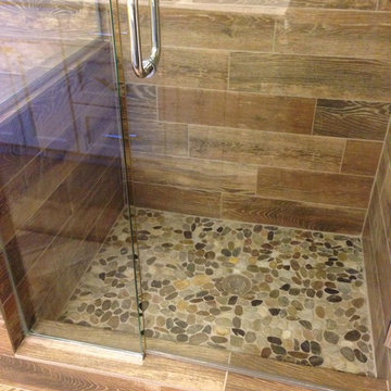 Shower remodel: Natural look with mosaic flat rock pebbles and wood-looking tile