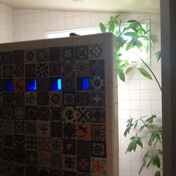 Shower wall with hollow glass tiles
