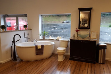 Inspiration for a master bathroom remodel in Other with raised-panel cabinets, black cabinets and granite countertops