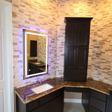 Side and front lit LED mirror with new cabinets, 3cm granite, and finished split