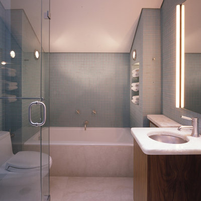 Example of a trendy blue tile and mosaic tile bathroom design in San Francisco with an undermount sink, flat-panel cabinets, dark wood cabinets and a one-piece toilet