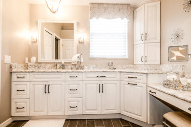Design ideas for a medium sized traditional ensuite bathroom in Tampa with raised-panel cabinets, white cabinets, a walk-in shower, beige walls, ceramic flooring, a submerged sink and granite worktops.