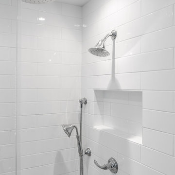 Simplistic Master Bathroom with a Frameless Shower