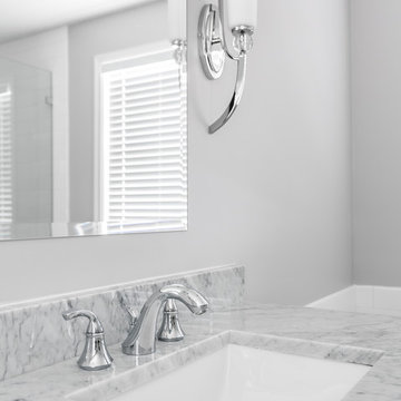 Simplistic Master Bathroom with a Frameless Shower