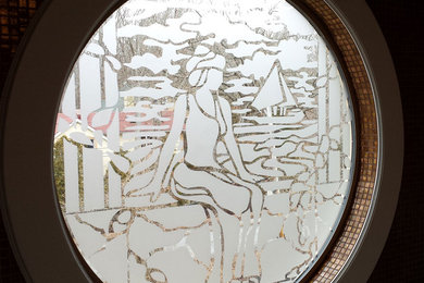 Sitting Woman with Boat Art on Round Window