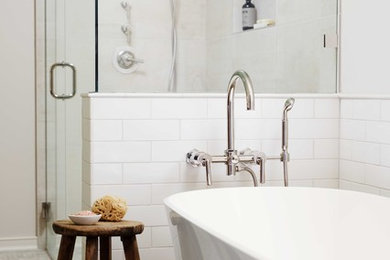 Example of a mid-sized trendy master white tile and ceramic tile mosaic tile floor bathroom design in Portland with shaker cabinets, a one-piece toilet, beige walls, an undermount sink, quartz countertops, a hinged shower door and white countertops