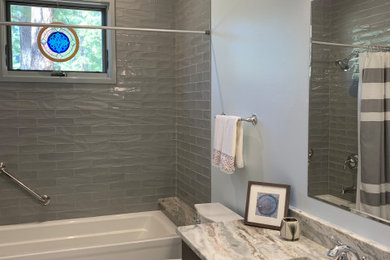 Inspiration for a mid-sized farmhouse master blue tile and porcelain tile porcelain tile and gray floor bathroom remodel in Albuquerque with brown cabinets, a one-piece toilet, white walls, an undermount sink, quartzite countertops and white countertops