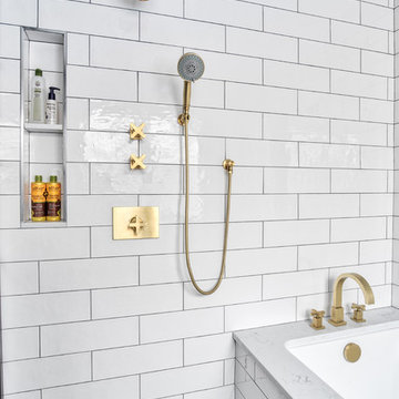 Sleek White and Brass Shower with Niche