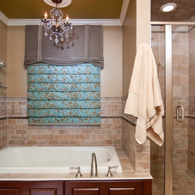 Bathroom - small traditional master ceramic tile and brown tile ceramic tile and beige floor bathroom idea in New York with dark wood cabinets, an undermount sink, raised-panel cabinets, marble countertops, a two-piece toilet, brown walls and a hinged shower door