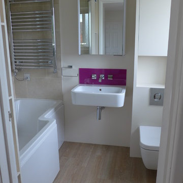 small bathroom design with shower bath and wall-hung suite