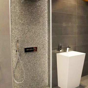 Small bathroom with custom mosaic shower
