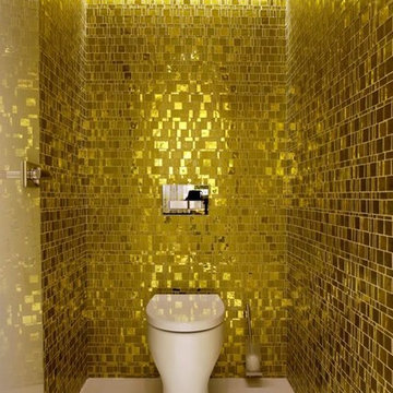 Small bathroom with gold colored mosaic tile