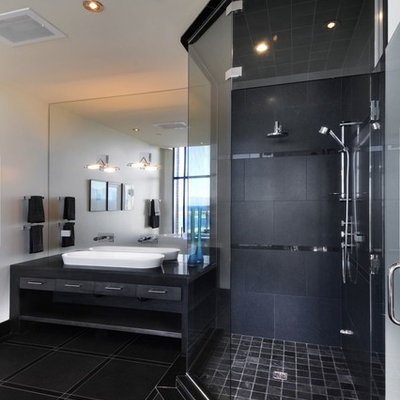 Inspiration for a contemporary black tile bathroom remodel with a vessel sink