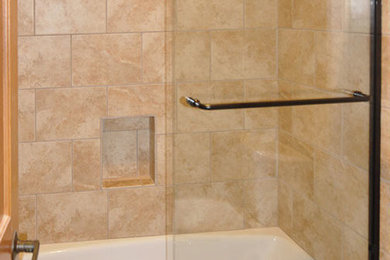 Small trendy 3/4 beige tile tub/shower combo photo in San Francisco