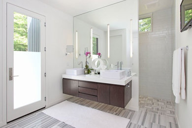 Inspiration for a contemporary white tile and subway tile bathroom remodel in Chicago with a vessel sink, flat-panel cabinets, dark wood cabinets and white walls