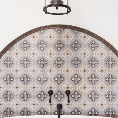 Inspiration for a huge southwestern master multicolored tile and ceramic tile terra-cotta tile and orange floor bathroom remodel in San Diego with raised-panel cabinets, medium tone wood cabinets, white walls, a vessel sink, a hinged shower door and gray countertops