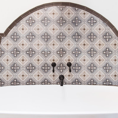 Bathroom - huge southwestern master multicolored tile and ceramic tile terra-cotta tile and orange floor bathroom idea in San Diego with raised-panel cabinets, medium tone wood cabinets, white walls, a vessel sink, a hinged shower door and gray countertops