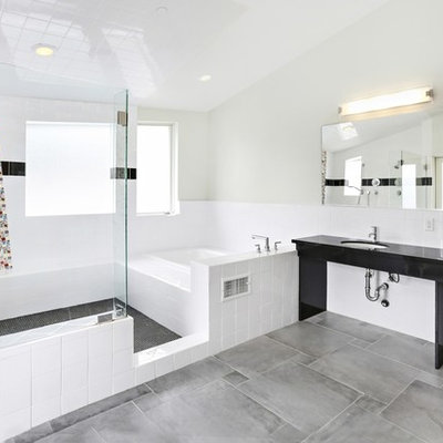 Inspiration for a mid-sized modern master black and white tile and porcelain tile porcelain tile and gray floor bathroom remodel in Los Angeles with a two-piece toilet, gray walls, an undermount sink and solid surface countertops