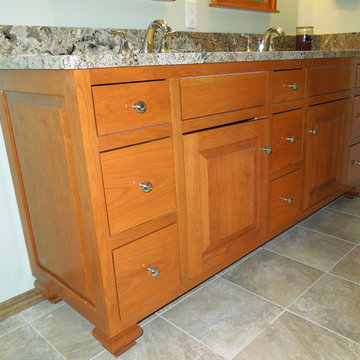 Solid vanity features feet and decorative furniture end