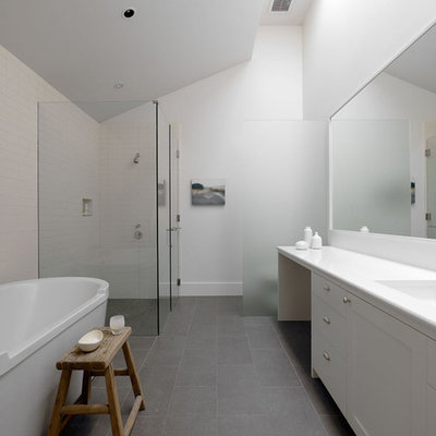Example of a minimalist gray floor bathroom design in San Francisco with white countertops