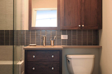 Inspiration for a transitional beige tile and ceramic tile alcove shower remodel in Chicago with an undermount sink, shaker cabinets, medium tone wood cabinets, quartzite countertops and a two-piece toilet