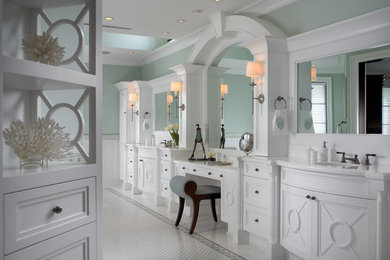 Beach style mosaic tile marble floor bathroom photo in Miami with white cabinets and marble countertops
