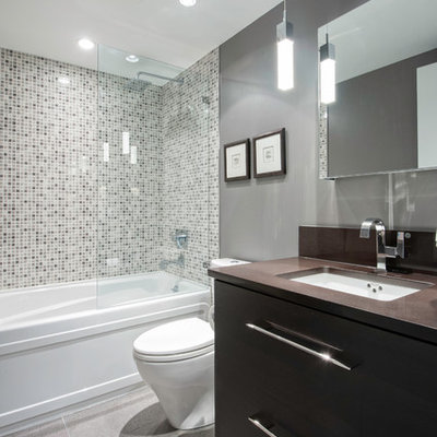 Bathroom - small contemporary mosaic tile and gray tile ceramic tile bathroom idea in Vancouver with an undermount sink, flat-panel cabinets, dark wood cabinets, quartz countertops, a one-piece toilet and gray walls