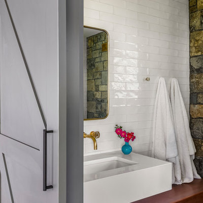Bathroom - small rustic 3/4 white tile and subway tile porcelain tile bathroom idea in New York with open cabinets, medium tone wood cabinets, a one-piece toilet, a trough sink and wood countertops